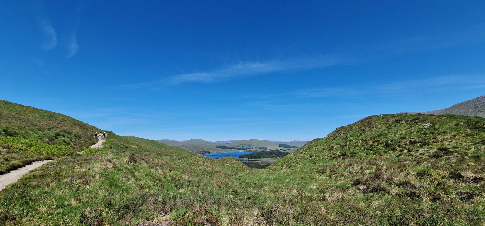 Clear blue skies over mountain trail